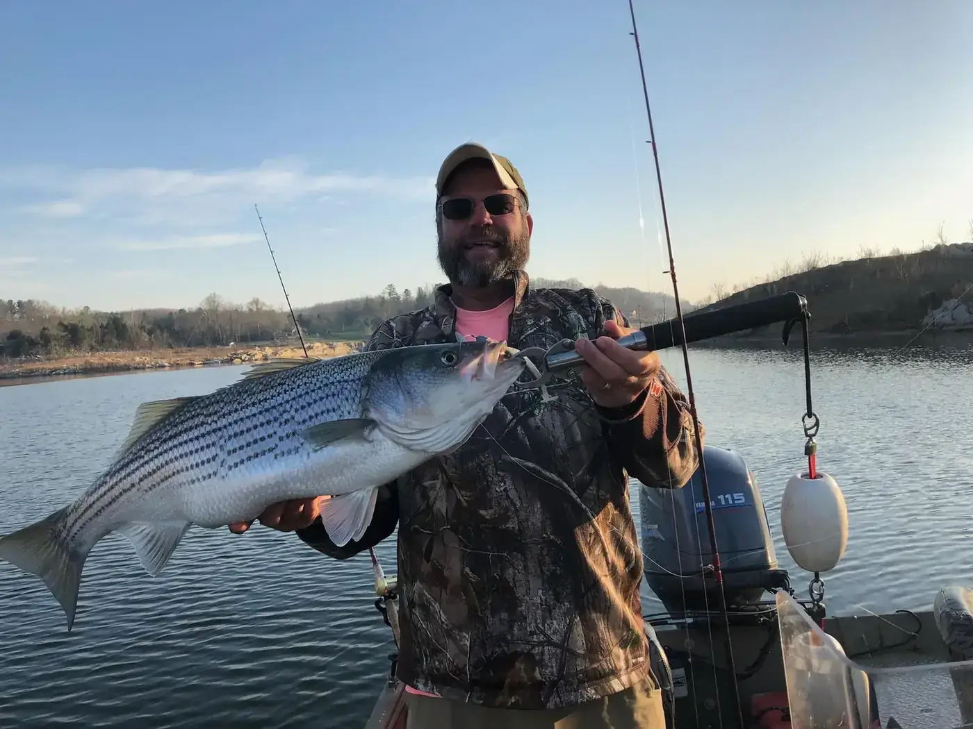 An angler with an East Tennessee striper on a cast and blast afternoon