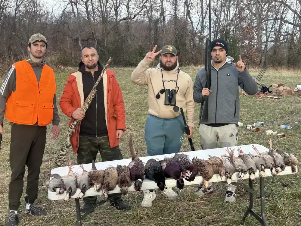 Hunters with their birds