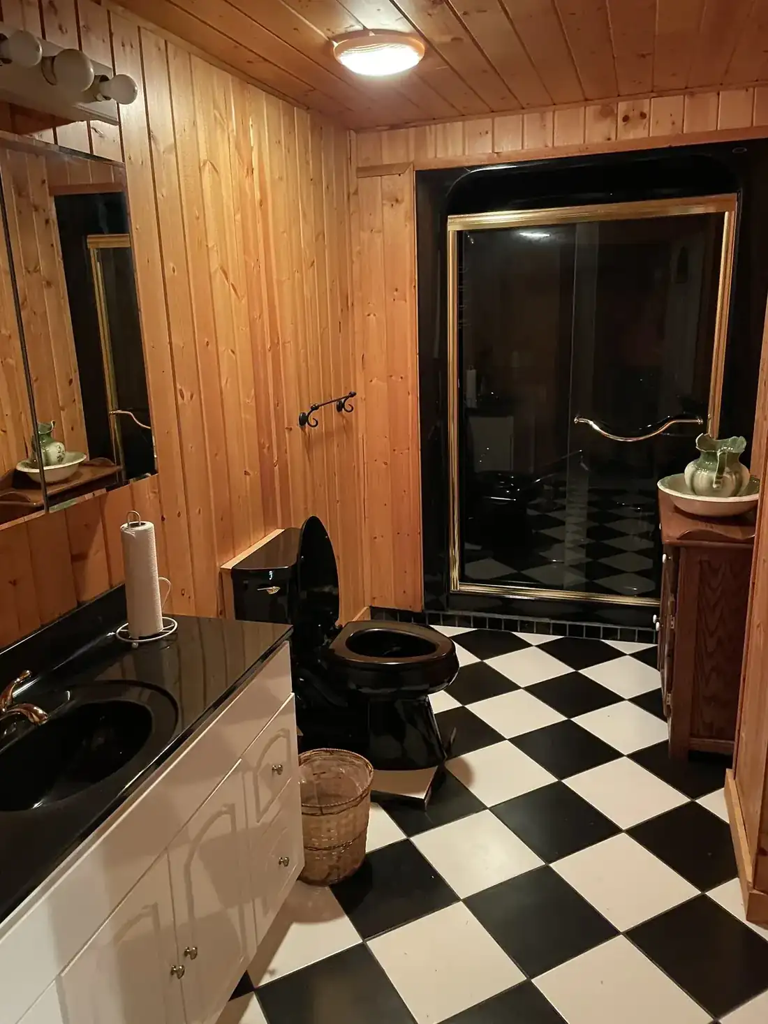 Pine-paneled bathroom inside the four-bedroom R&D lodge